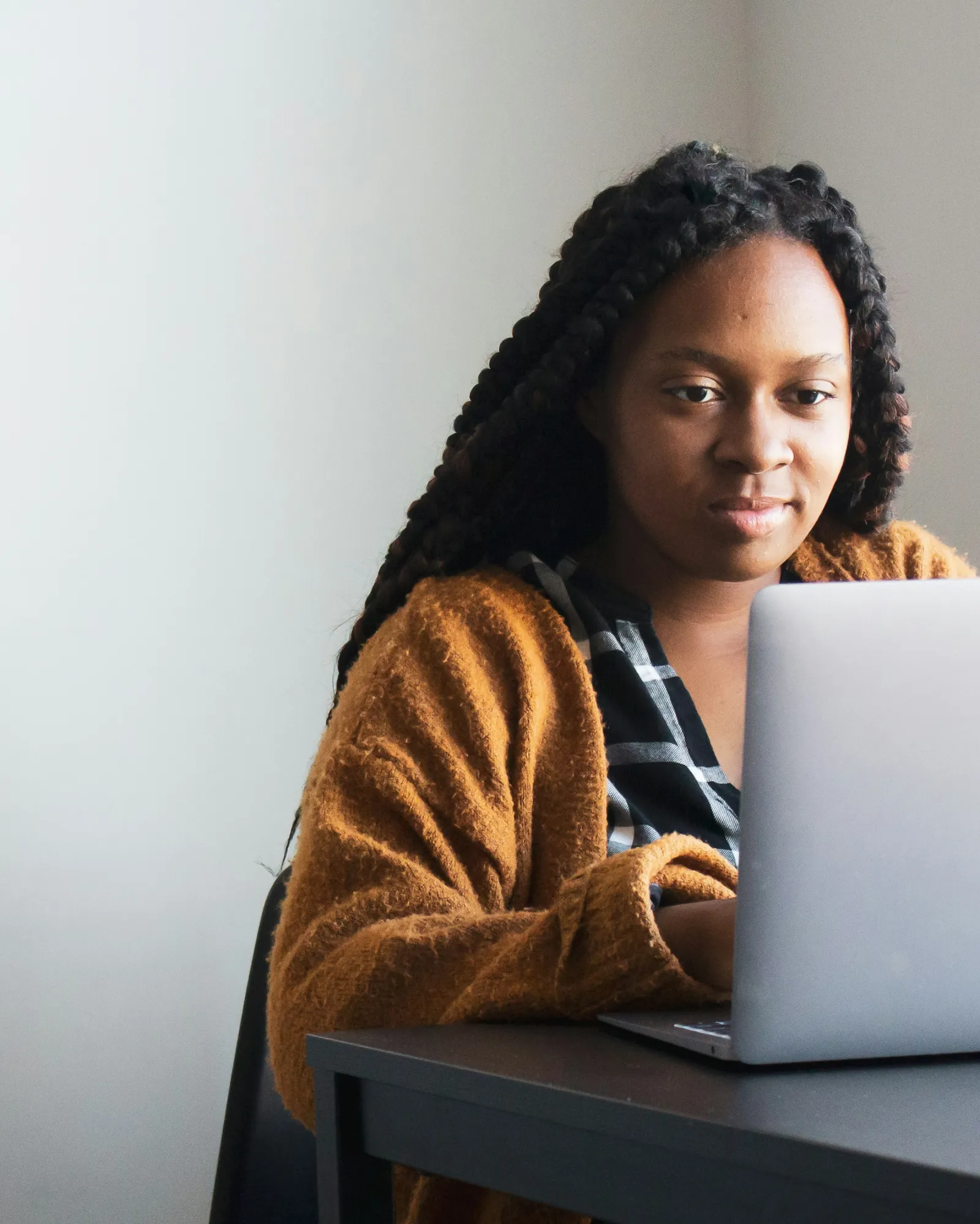 A young business owner working on her laptop