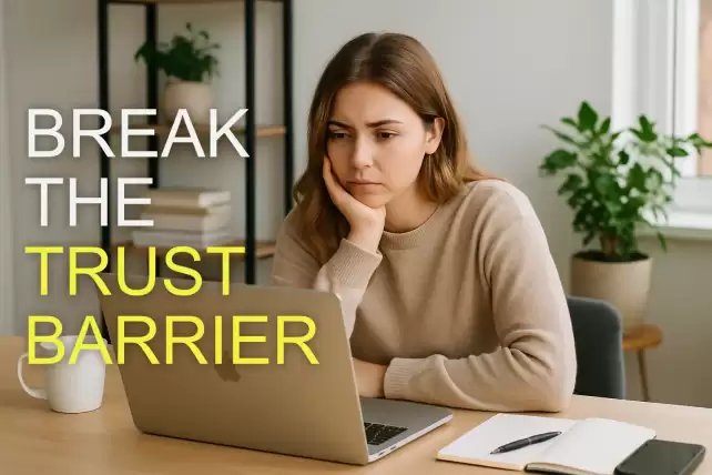 a young Caucasian female small business owner sitting at a desk in a bright home office, looking at her laptop screen with a thoughtful, slightly concerned expression
