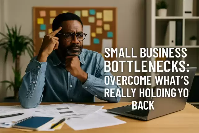 African entrepreneur in business attire sitting thoughtfully at a desk with a laptop, symbolizing overcoming small business bottlenecks.